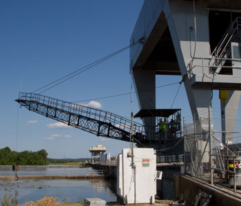 Photograph of river control structure and a crane