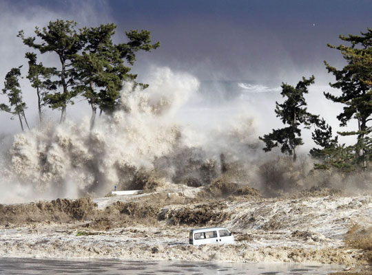 Photograph of a tsunami striking the northeastern coast of Japan