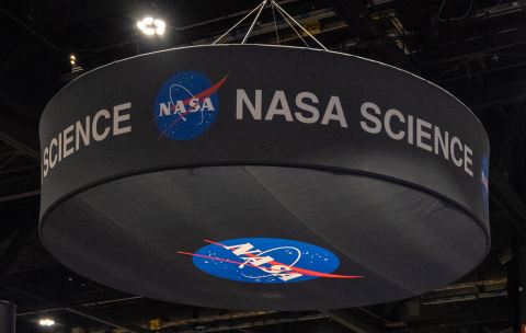 Image of black NASA ceiling banner, with NASA logo on bottom and words NASA Science around rim